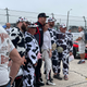 The guys wore the cow suits all weekend. Even for their picture with Porsche Driver Katherine Legge.